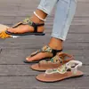 Nuevas sandalias cruzadas para mujer de talla grande, estilo étnico con cuentas de suela plana, chanclas de playa para exteriores europeas y americanas, zapatos de mujer en negro