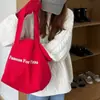 Moda 2025 Nova Bolsa Tote de Ombro com Letras Vermelhas Casual Estudante Nicho Comutador Grande Capacidade Bolsa de Lona