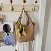 Bolso de mano cruzado de estilo coreano, simple y versátil, nuevo bolso tipo cubo de moda primavera 2026, bolso de hombro y cruzado casual