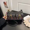 Bolso de mano para mujer transfronterizo nueva colección otoño/invierno 2026: bolso de motocicleta retro de moda estilo baguette, bolso de hombro y cruzado de alta gama