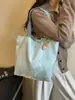 Bolso de mujer suave y liso de alta calidad, nuevo modelo 2026, bolso tote de gran capacidad para el trabajo diario, bolso de hombro versátil para comercio exterior