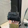 Elegante y moderna bolsa de nicho con lazo para mujer, nueva moda, bolso cruzado versátil, bolso de mano de color liso para salir