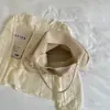 Bolsa casual com padrão trançado para mãe e filha, nova bolsa tote de grande capacidade estilo coreano nicho, bolsa de ombro e axila feminina para o dia a dia