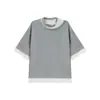 Top unisex de manga corta, diseño americano Nanxia, patchwork, falso dos piezas, cuello escalonado gris y blanco, corte holgado, para hombre