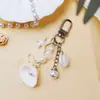 Colgante de Cadena para Teléfono con Cuentas de Estrella de Mar y Concha Blanca de Océano Llavero de Caracola Encanto de Bolso de Cadena para Cámara Ccd