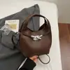 Bolso de mano pequeño de moda con estampado de lichi transfronterizo para mujer, nueva colección 2026, bolso tote para el trabajo, bolso tipo cubo, bolso cruzado moderno y elegante