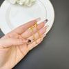 Nuevos Pendientes de Arena Dorada Vietnamita Estilo Chino Pendientes de Borla con Cuentas Huecas de Mariposa Joyería Versátil Simple para Mujer Venta al por Mayor