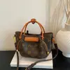 Bolso de Mano Versátil de Moda con Estampado Retro de Alto Valor Transfronterizo para Mujer 2026 Nuevo Diseño de Nicho Bolso de Hombro Cruzado