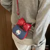 Bolso pequeño cuadrado de dibujos animados para niñas con lazo simple 2026 nuevo otoño e invierno nicho diario bolso de hombro bolso cruzado