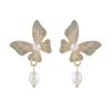 Dulce chica súper hada aguja de plata S925 aretes vintage de mariposa sueño púrpura aretes de temperamento de perla de agua dulce suave
