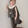 Traje de Verano para Niñas de Algodón y Lino con Estampado Floral 2026 Nuevo Conjunto de Dos Piezas con Chaleco sin Mangas con Adorno de Encaje y Pantalones de Campana para Bebé