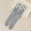 Calcetines para niñas con lazos, calcetines de tubo alto, nuevo estilo primavera y otoño 2026, hasta la rodilla, lindos, color liso, calcetines de algodón para niños para niñas, venta al por mayor