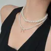 Collar de doble capa con cuentas, lazo y circonita de perla, cadena para la clavícula de temperamento elegante francés, joyería de lujo ligero de alta gama para mujer