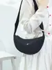 Bolso bandolera de nailon para mujer 2026 nuevo bolso de moda tipo albóndiga ligero pequeño bolso de hombro bolso de axila versátil bolso de hombro de lona