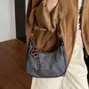 Bolsa de Design de Nicho em Forma de Meia-Lua Feminina 2025 Novo Estilo Coreano Retrô Ombro Único Transversal Pequena Bolsa Estilo Ocidental Bolsa de Dumpling Transfronteiriça