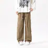 Calça cargo masculina da moda Hong Kong para primavera e outono, com bolso na frente, tamanhos grandes, corte solto, calça esportiva casual