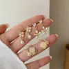 Pendientes Serie Flor de Cerezo Rosa para Mujer, Agujas de Plata, Elásticos, Dulces, Florales, de Nicho, de Gama Alta, Versátiles