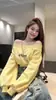 Sudadera corta amarilla de estilo coreano 'hot girl' con hombros descubiertos para mujer, nueva otoño 2026, estilo holgado y casual