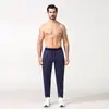 Pantalones de correr profesionales para hombre, diseñados para carreras matutinas, maratones y carreras nocturnas. Presentan tejido de secado rápido, bolsillos y forro polar, lo que los hace adecuados para otoño e invierno.