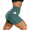 Shorts de yoga de verano de tiro alto para mujer, que levantan los glúteos, color sólido, con diseño de tres bolsillos, disponibles para venta al por mayor y en stock