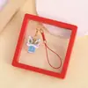 Colgante para teléfono móvil de danza del león de bendición, accesorio para bolso y llavero de coche, colgante auspicioso de hilo rojo estilo chino, disponible para venta al por mayor
