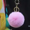 Al por mayor en stock Bola de pelo de imitación de conejo Rex de 8 cm llavero colgante lindo para mujer bolso de coche teléfono móvil colgante de felpa