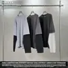 Fábrica de Fonte de Moda Masculina Estilo Corrente Novo Produto Primavera 2026 Falso de 2 Peças Manga Longa Desgastada Bloco de Cores Retro Camiseta 100% Algodão para Homens.