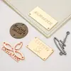 Placa de nombre de herraje para ropa perforada, logo tridimensional cóncavo-convexo imprimible, aleación de zinc, galvanoplastia, producción de etiqueta de señal para equipaje
