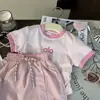 Ropa coreana para niños 2025 nuevo verano niñas combinación de colores letra camiseta de manga corta pantalones cortos rosas para niños conjunto de dos piezas moda
