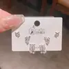 2026 Nuevo Diseño Aretes de Botón de Tulipán Mariposa Circonita Tres Pares Aguja de Plata Exquisito Tacto de Alta Gama Aretes Delicados 6 Piezas