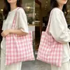 Bolso tote de estilo coreano, suave y femenino, a cuadros rosas y blancos con lazo bordado, un bolso de hombro elegante y versátil adecuado para el trabajo y los desplazamientos