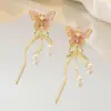 Pendientes de Perla con Gradiente de Mariposa Estilo Bosque de Hadas Super 2026 Pendientes Largos Asimétricos con Cadena y Borla con un Toque de Lujo