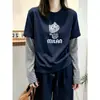 Camiseta Manga Longa Patchwork Listrada Falsa Duas Peças Feminina Outono 2026 Solta Modeladora Senso de Design Camiseta Básica Cartoon