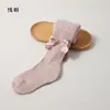 Coleção de primavera e outono transfronteiriça: leggings infantis com design estilo princesa, versáteis para usar como peça externa, com listras verticais e um laço grande, adequados para meninas