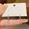 Pendientes metálicos simples, elegantes y compactos con un diseño único, pendientes de estrella de circón, nuevos pendientes de moda de celebridad de Internet 2026
