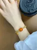 Pulseira de cera de abelha amarela caramelo de segunda geração, pulseira com pingente de palavra Jinle em areia dourada, pulseira elástica, presente para mulheres