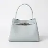 Nova bolsa de mão feminina em couro genuíno, bolsa de ombro e crossbody casual e versátil, bolsa Kelly de alta qualidade simples e luxuosa para exportação