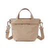 Bolso de mano pequeño nuevo, ligero y versátil para mujer, bolso de hombro y cruzado, bolso casual para hombre, bolso tipo cubo impermeable para uso diario