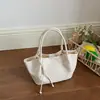 Bolso de Cubo Tejido de Alta Gama para Mujer 2026 Nuevo Estilo Coreano Bolso de Hombro Cruzado para el Trabajo Moda Elegante Bolso Plateado para Mujer
