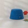 Sombrero infantil estilo Corea del Sur primavera nuevo lindo pegatinas de dibujos animados sombrero tipo cubeta de copa plana sombrero de pescador para bebé a prueba de sol para viaje