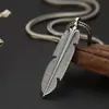 Venta al por mayor plata de ley s925 personalidad moda simple colgante de pluma coreana Plata tailandesa do viejo teñido de negro cadena de moda para hombres y mujeres colgante