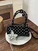 Bolso de mano coreano nuevo transfronterizo 2026, bolso tote pequeño para mujer, bolso cilíndrico de nicho de lunares de alta gama, bolso de hombro y bandolera