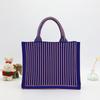 En bolsa de punto color rojo neto bolsa tejida tipo fly bolsa tote versión coreana del nuevo bolso de mano gran capacidad bolsa de compras para estudiante mujer fabricantes
