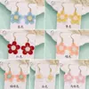 Pendientes pequeños frescos y exquisitos de personalidad, alto sentido de temperamento, pendientes de flor de sol tejidos, clip para la oreja simple, joyería para la oreja