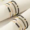 Pulsera de Moda para Mujer Tejida a Mano con Cuentas de Cristal Negro Curvadas y Cuentas de Arroz, Nuevo Set de Múltiples Piezas, Transfronterizo Europeo y Americano