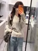 Suéter de tricô branco estilo preguiçoso com decote V e manga morcego manga longa feminino 2026 início do outono estilo coreano justo macio pegajoso cintura marcada top
