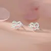 Pendientes de Plata Pura S999 Estilo Coreano Corazón Entrelazado Lazo Dulce Princesa Frescos Para Orejas Sensibles Pendientes de Nicho Venta al por Mayor