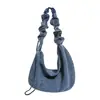 Colección de otoño 2026 transfronteriza: Bolsa de mezclilla tipo dumpling de gran capacidad, a la moda, estilo coreano, simple y adecuada para ir al trabajo