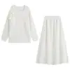 Venta al por mayor de ropa para mujer estilo europeo y americano transfronteriza, conjunto de punto de top largo de manga larga floral moderno y elegante y falda de punto tipo umbrella de cintura alta