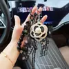 Llavero de Camelia con Cinta de Lazo de Encaje Estilo Coreano Cuerda Trenzada Cadena de Cuentas Creativa Colgante para Bolso de Moda para Mujeres